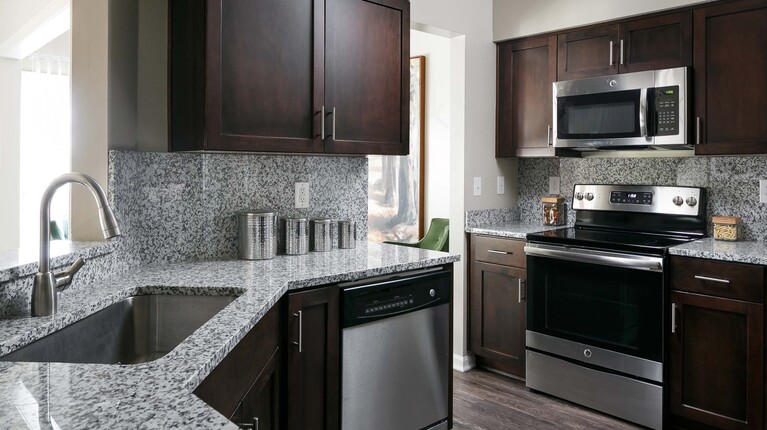 Modern Kitchen with Granite Countertops and Custom Cabinetry