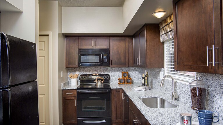 Modern Kitchen with Granite Countertops and Custom Cabinetry