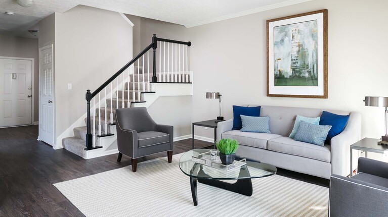 Living Space with Wood-Inspired Plank Flooring and Crown Molding